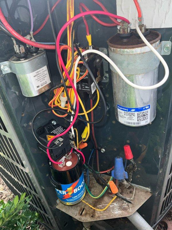 Responded to no cooling call on residential air conditioning system. Upon arrival, inspected outdoor condenser unit and found failed dual run capacitor with visible signs of deterioration, corrosion, and bulging. Replaced defective capacitor with new OEM-rated component, verified proper microfarad ratings for compressor and fan motor. Tested system operation, confirmed compressor and condenser fan motor startup, and verified proper cooling cycle. Unit restored to normal operation.