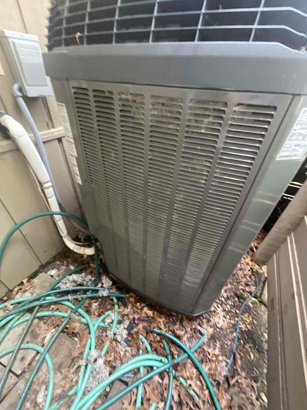 Responded to no cooling complaint and evaluated existing HVAC system consisting of an XV20i variable-speed heat pump and XL1050 control. Documented current equipment condition showing weathering and debris accumulation on outdoor unit. Advised customer that upgrading to high-efficiency Trane equipment utilizing new refrigerant will require replacing the existing XL1050 control due to incompatibility with updated refrigerant specifications. Prepared comprehensive equipment replacement estimate for air conditioning system and coil replacement to restore cooling functionality and improve system efficiency.
