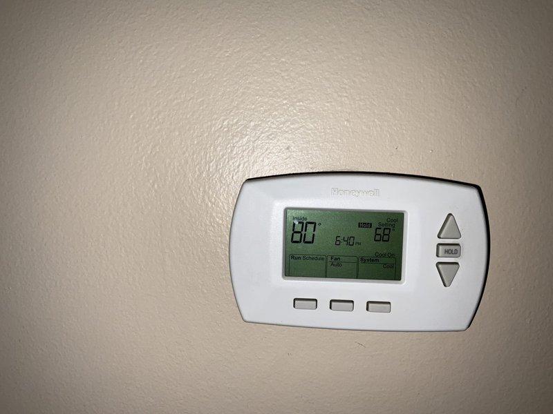 Responded to no cooling complaint on Trane air handler system. Upon arrival, found thermostat displaying 80°F actual temperature while set to 68°F with system calling for cooling. Performed complete system diagnostics and spring maintenance service, inspecting air handler unit in attic installation, verifying proper airflow, checking refrigerant levels, and testing all electrical components. System restored to proper cooling operation with thermostat responding correctly to temperature settings.