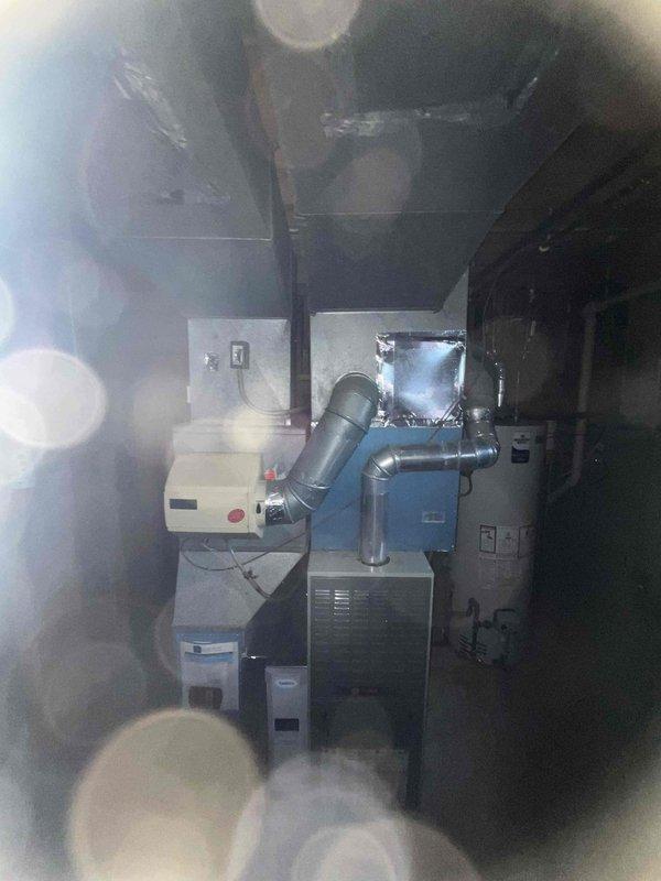 Completed comprehensive BFMA tune-up service on 7+ year old HVAC system including full air conditioning maintenance and filter replacement. Inspected and serviced indoor furnace unit in basement mechanical room, verified proper operation of all components, and replaced air filter. Performed outdoor condenser unit maintenance including electrical connection inspection, capacitor testing, refrigerant level verification, and thorough cleaning of coils and components to ensure optimal system performance for the cooling season.
