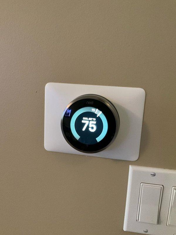 Completed comprehensive BFMA tune-up service on 6-year-old air conditioning system. Performed standard maintenance protocol including system inspection, thermostat verification showing unit cooling to 75°F setpoint, and condenser unit service. Removed accumulated organic debris including leaves and plant material from condenser fan assembly and interior housing, cleaned fan blades and motor area, and verified proper airflow through unit.