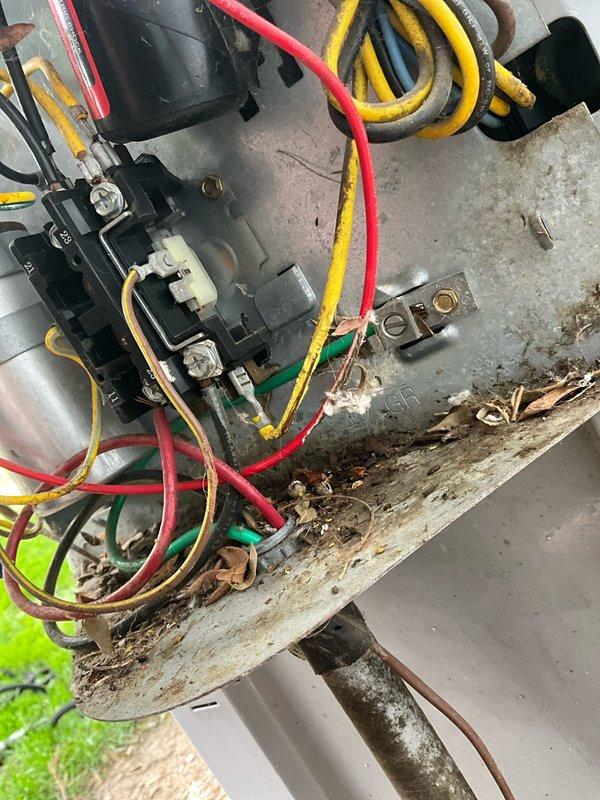 Completed comprehensive BFMA tune-up on 16+ year old outdoor AC unit. Inspected and tested capacitor showing signs of corrosion and rust, verified all electrical connections and wiring across terminal blocks, cleaned accumulated debris and organic matter from unit housing and mounting surfaces. System operational with all components functioning within normal parameters upon completion.