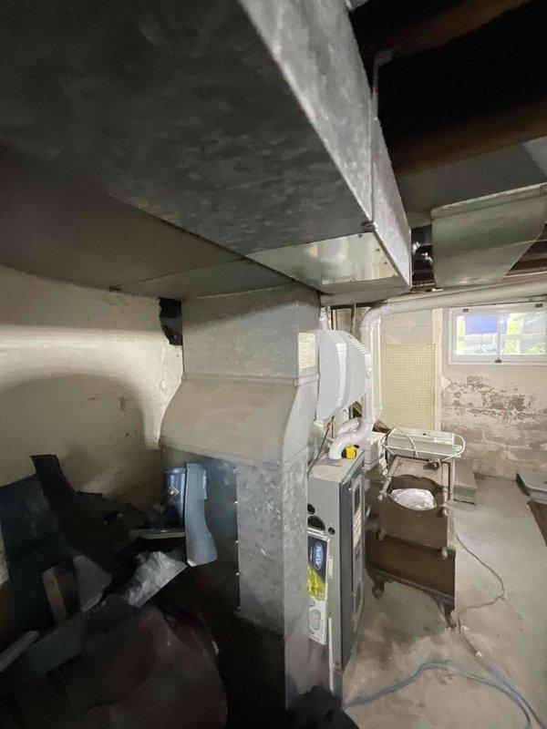 Conducted sales estimate for new air conditioning system installation in residence with no existing AC equipment. Assessed basement furnace location and existing HVAC infrastructure including Aprilaire humidification system to determine optimal equipment placement and ductwork modifications required for complete cooling system integration with evaporator coil installation.