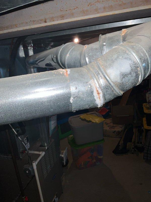 Conducted comprehensive full system HVAC estimate at residential property with basement mechanical room installation. Evaluated existing electrical infrastructure including circuit breaker panel with dedicated AC circuits, assessed ductwork system with insulated horizontal supply runs and elbow configurations showing age-related wear, and documented mechanical equipment location. Provided equipment replacement recommendations based on current system condition, home comfort requirements, and infrastructure compatibility for complete heating and cooling system upgrade.