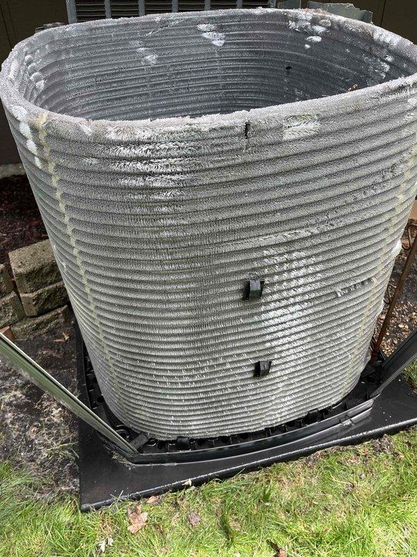 Completed comprehensive air conditioning tune-up on residential system over 3 years old during afternoon service window. Performed full system inspection including air handler components, electrical connections, and outdoor condenser unit. Observed heavy frost accumulation on condenser coil indicating potential refrigerant flow restriction or airflow issues; documented condition with photos for customer records and recommended monitoring system performance.