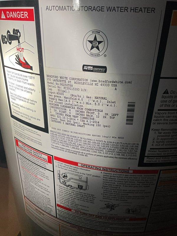 Responded to no hot water complaint on Bradford White 50-gallon natural gas water heater, model BG250T6N. Upon arrival, confirmed drain pan was full of water indicating active leak from tank. Inspected unit and determined tank failure requiring water heater replacement. Documented existing installation specifications including 3/4" water connections and 1/2" gas connection for replacement equipment procurement.