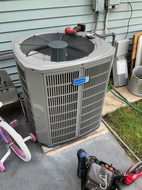 Completed comprehensive BFMA tune-up on American Standard outdoor condensing unit aged 4+ years at residential property. Performed standard preventive maintenance protocol including inspection of refrigerant lines, electrical connections, and condenser coil cleaning. Accessed indoor air handler unit in basement crawl space and inspected evaporator coil, condensate drain system including PVC drain lines and T-joint connections, and verified proper airflow through ductwork. System tested and operational upon completion.
