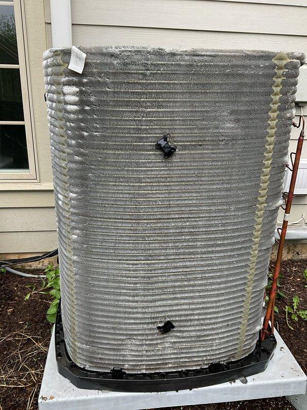 Completed comprehensive BFMA tune-up service on residential air conditioning system aged 2+ years. Performed full AC system inspection and maintenance on outdoor condenser unit, including coil cleaning, refrigerant line inspection, and verification of service port operation. Replaced dirty pleated air filter to restore proper airflow and system efficiency.
