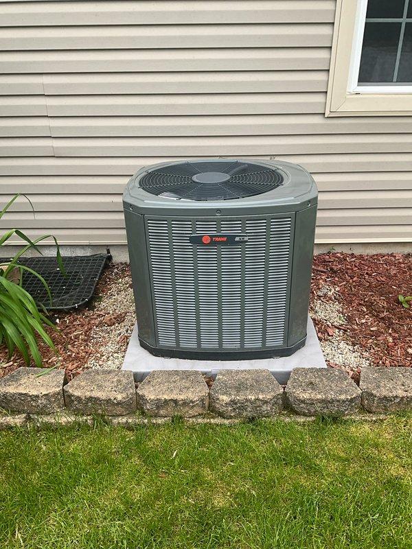 Performed comprehensive BFMA tune-up service on Trane residential air conditioning system. Completed full system inspection, removed front access panel to expose condenser coil which showed moderate dust and debris accumulation between fins, cleaned coil surfaces, verified unit operation, and restored all panels. System operating within normal parameters upon completion.