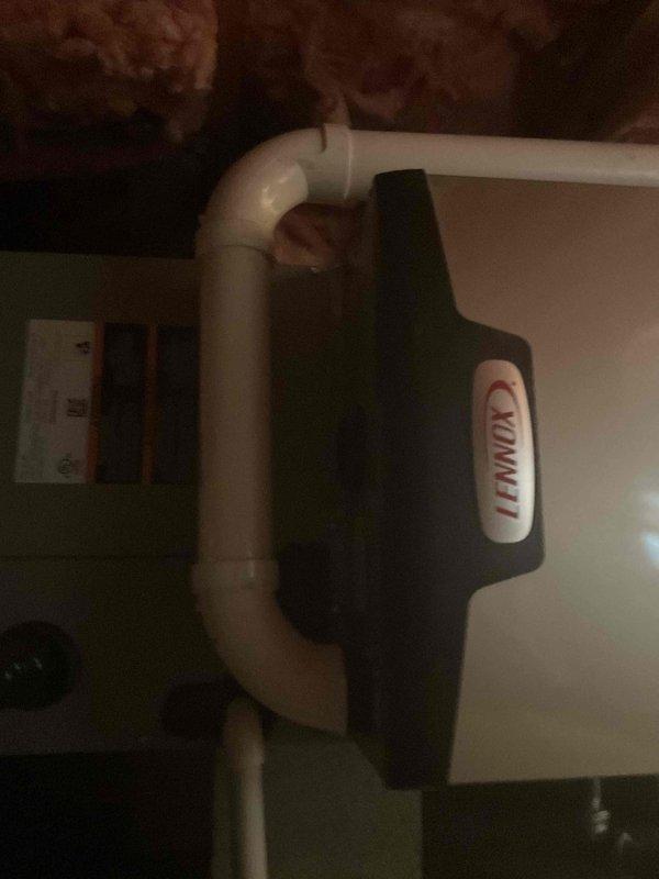 Completed furnace replacement in crawl space serving sunroom addition, installing Lennox EL297UH045XV36BK high-efficiency unit. Removed old furnace equipment from 2008 along with previously abandoned unit that contractor had left in place during prior replacement. Integrated new system with existing 2024 AC installation, connected to Honeywell Home digital thermostat, and installed proper PVC venting through crawl space.