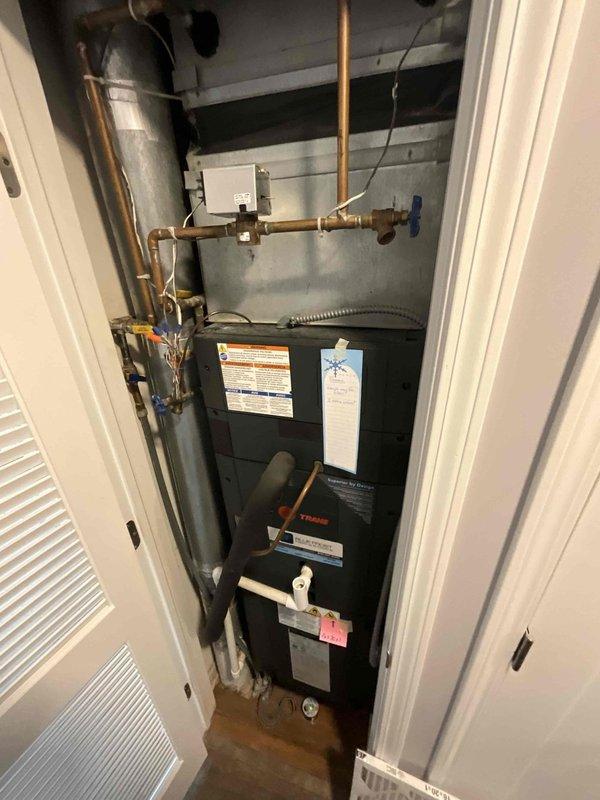 Completed comprehensive BFMA tune-up service on residential air conditioning system with equipment age 8+ years. Coordinated roof access with facility management, performed full system inspection of air handler unit and condensing unit, checked refrigerant pressures and temperatures using digital gauges, inspected copper line set and gas connections with shutoff valves, and verified proper operation of all mechanical components. System found operating within manufacturer specifications with no immediate concerns noted.