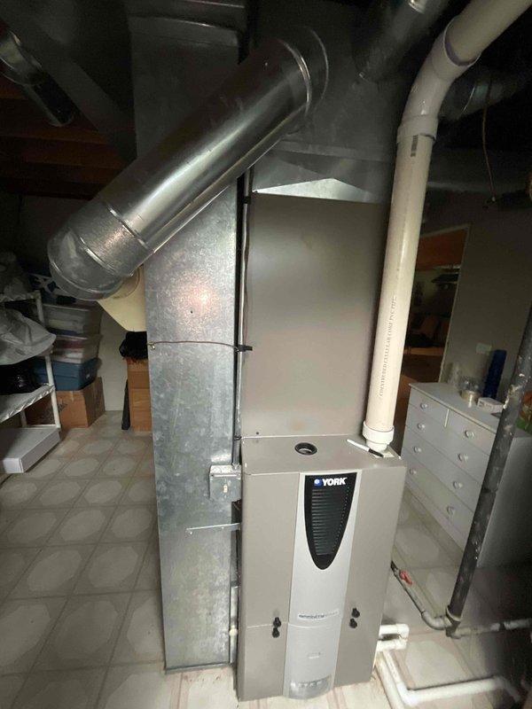 Conducted comprehensive full system estimate for residential HVAC replacement. Evaluated existing York furnace/air handler installation in basement utility space, assessed current ductwork configuration including galvanized metal trunk lines and flexible branch ducts, and documented condensate drainage and venting systems. Photographed equipment layout, clearances, and mechanical room conditions to provide accurate replacement specifications and system design recommendations.