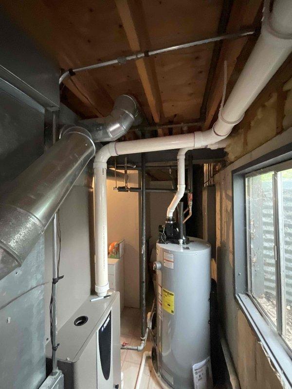 Conducted comprehensive full system estimate for residential HVAC replacement. Evaluated existing York furnace/air handler installation in basement utility space, assessed current ductwork configuration including galvanized metal trunk lines and flexible branch ducts, and documented condensate drainage and venting systems. Photographed equipment layout, clearances, and mechanical room conditions to provide accurate replacement specifications and system design recommendations.