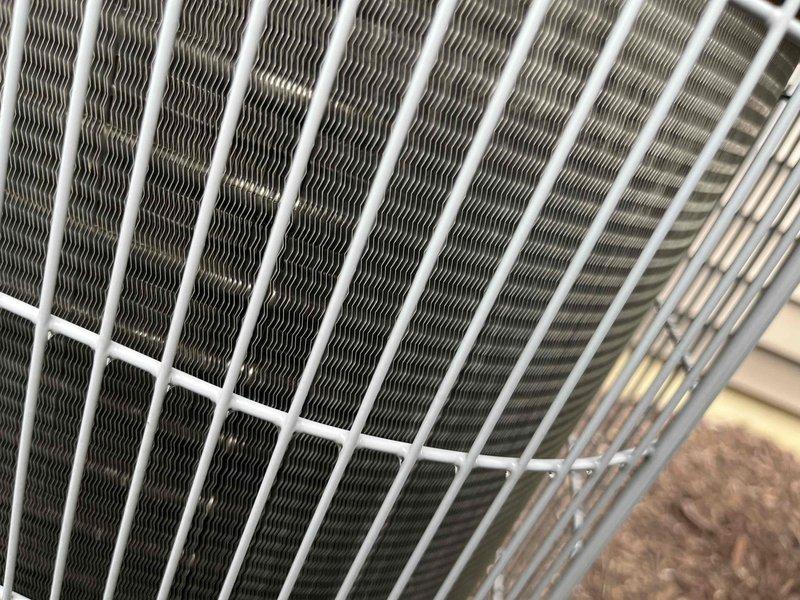 Completed comprehensive BFMA tune-up service on a 4-year-old air conditioning system during scheduled morning appointment. Performed standard preventive maintenance protocol including inspection of outdoor condenser unit with protective wire guard, verified proper fin alignment and heat exchanger condition, and accessed indoor air handler components in attic space to complete full system evaluation and tune-up procedures.