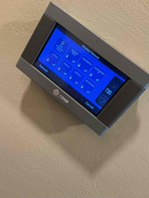 Completed comprehensive BFMA tune-up service on a 7+ year old Trane air conditioning system. Performed standard maintenance procedures on both indoor and outdoor units, including inspection of the outdoor condenser unit, refrigerant line set, electrical connections, and wall-mounted Trane touchscreen thermostat. All components were found to be in good operational condition with system operating within manufacturer specifications.