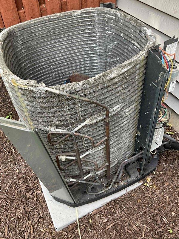 Completed summer HVAC tune-up on residential heat pump system. Thoroughly cleaned heavily soiled condenser coil that had significant accumulation of dust, dirt, and lint buildup affecting heat transfer efficiency. Inspected and serviced outdoor unit including electrical connections, refrigerant lines, and control panel. Checked indoor air filter which showed moderate dust accumulation and recommended replacement for optimal airflow and system performance.
