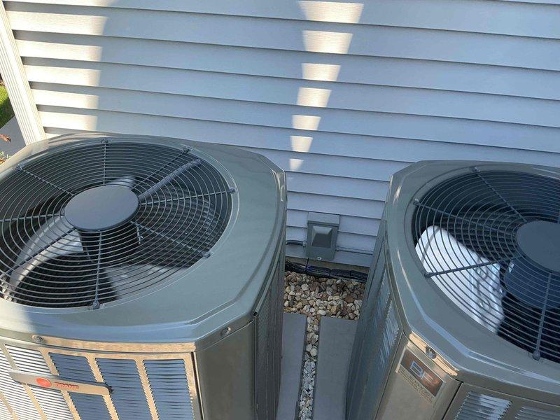 Completed comprehensive tune-up service on dual HVAC condenser units at residential property. Performed standard maintenance protocol including inspection of both systems, electrical testing of capacitors using digital multimeter to verify proper microfarad readings, checked refrigerant levels, cleaned condenser coils, and inspected all electrical connections and components. Both units were found to be in good operating condition with all readings within manufacturer specifications, ensuring optimal system performance for the cooling season.