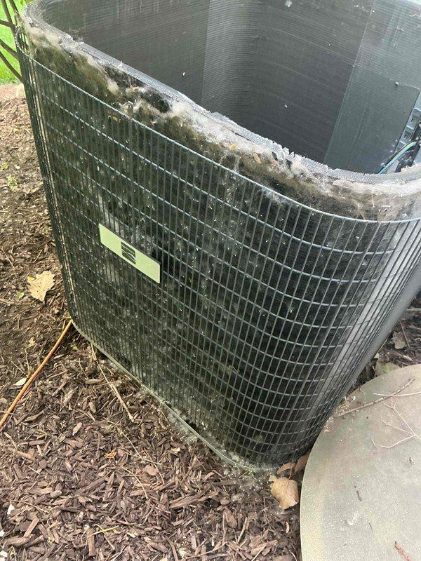Completed comprehensive BFMA tune-up on 13+ year old outdoor air conditioning unit. Performed electrical diagnostics using clamp meter to verify amp draw and system performance, inspected capacitor and electrical connections, and assessed overall unit condition. Unit exhibited significant dirt accumulation on condenser coil and exterior grille, along with heavy organic debris buildup on top surface requiring attention for optimal airflow and efficiency.