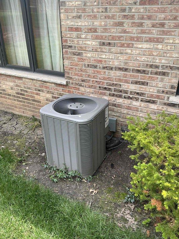 Conducted comprehensive assessment of existing HVAC system following previous inspection that identified major repair needs. Evaluated outdoor condensing unit positioned on concrete pad against brick exterior and inspected electrical panel showing significant deterioration and oxidation on interior door surface. Based on system age, extent of required repairs, and overall condition, provided detailed estimate for complete air conditioning system replacement including new condensing unit and evaporator coil to address existing deficiencies and restore reliable cooling operation.