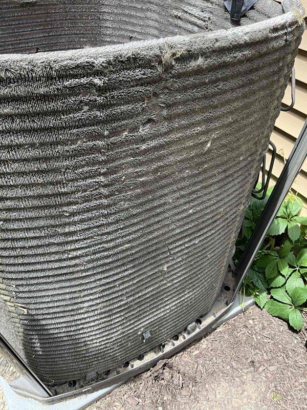 Completed comprehensive BFMA tune-up on 7+ year old air conditioning system. Upon arrival, outdoor condenser unit exhibited heavy accumulation of dust, dirt, and debris throughout coil fins and exterior surfaces. Performed thorough coil cleaning to remove substantial buildup that was restricting airflow and reducing heat transfer efficiency. Inspected copper refrigerant lines, electrical connections, and mounting hardware. Replaced air filter, verified proper system operation, and documented pre- and post-service conditions with photographs.
