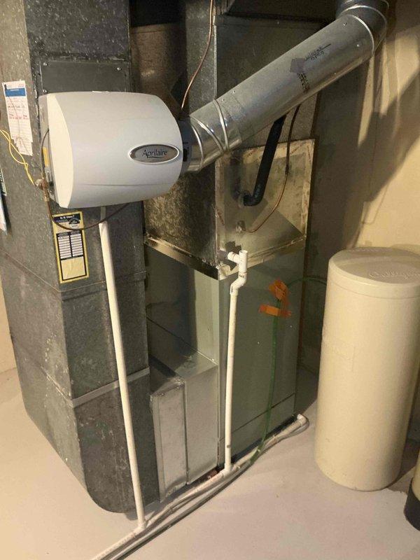 Conducted sales estimate for HVAC system replacement due to excessive compressor noise on existing unit. Evaluated current furnace installation with Aprilaire humidifier, ductwork configuration, and overall system performance in basement mechanical room. Documented equipment condition and provided replacement options for air conditioning unit and evaporator coil to address failing compressor and ensure proper system operation.
