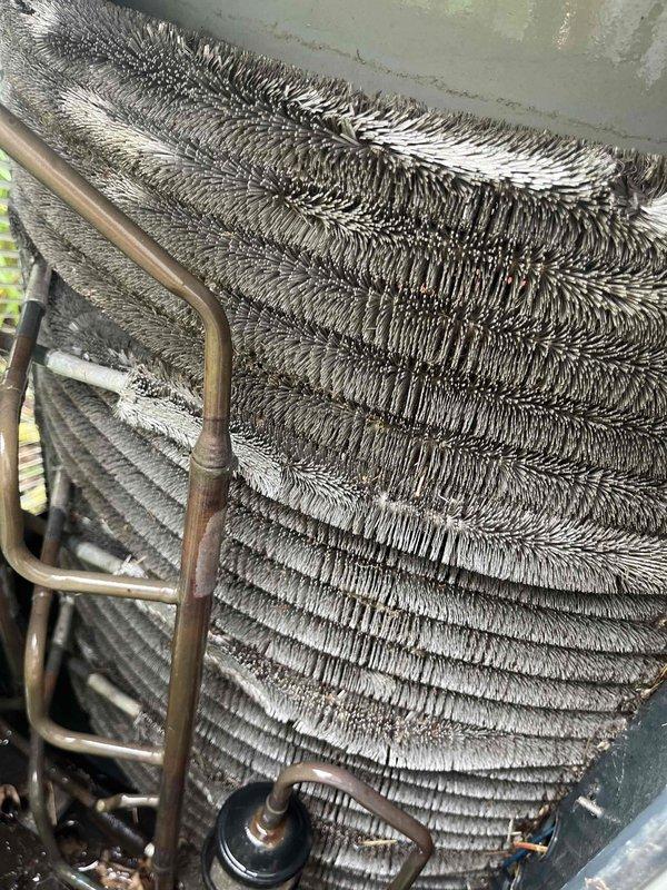 Completed comprehensive BFMA AC tune-up on 14-year-old system. Discovered evaporator coil experiencing severe frost and ice buildup, indicating restricted airflow or potential refrigerant issues. Inspected and replaced air filters, which showed signs of restriction contributing to the coil freezing condition. Performed standard maintenance protocol including system inspection, component cleaning, and operational testing to restore proper cooling performance.