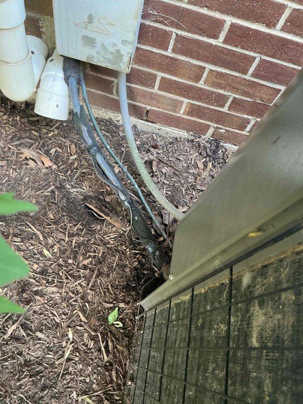 Responded to no cooling complaint on residential HVAC system over 10 years old. Upon arrival, inspected both indoor furnace unit in basement mechanical room and outdoor condensing unit. Found outdoor unit with weathered refrigerant lines showing signs of age and exposure, positioned on concrete pad with deteriorating appearance. Indoor furnace and associated PVC condensate drainage system appeared functional. Documented existing equipment condition with photos showing aging infrastructure consistent with system age. Unit requires further diagnostic testing to determine root cause of cooling failure, likely related to refrigerant system or compressor issues given age of equipment.