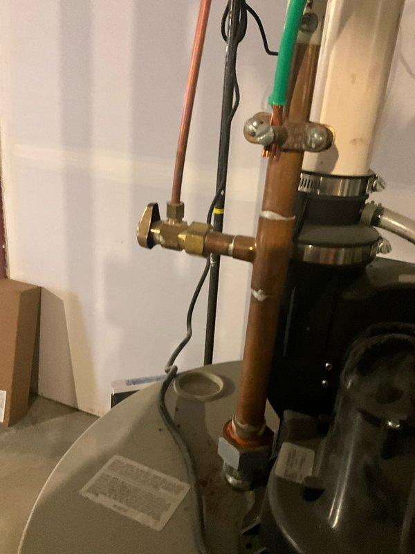 Completed comprehensive plumbing inspection and tune-up service during afternoon appointment. Performed thorough examination of water heater system, including assessment of pressure relief valve, temperature and pressure gauge readings, and copper supply line connections. Documented equipment condition through detailed photography, noting oxidation patterns on copper piping, secure mounting of all fittings and connections, and proper operation of shut-off valves. All components found to be functioning within normal parameters with no immediate repairs required.