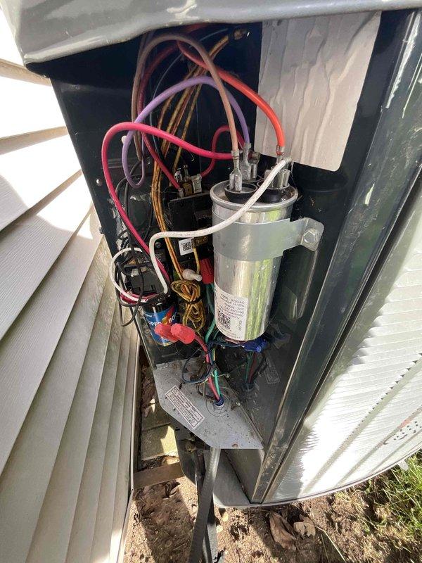 Completed comprehensive BFMA tune-up service on an 8+ year old outdoor air conditioning unit during afternoon appointment window. Performed thorough inspection of evaporator coils, which revealed heavy accumulation of dust, dirt, and debris significantly compromising system efficiency. Inspected electrical components including capacitor, contactor, and associated wiring connections; verified all connections were secure and functioning properly. Examined refrigerant lines for signs of wear or damage. Documented unit condition with detailed photographs showing internal components, coil condition, and electrical compartment. Recommended professional coil cleaning to restore optimal heat transfer efficiency and system performance.