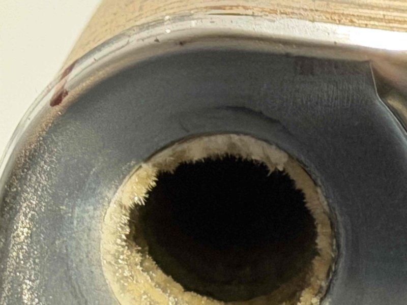 Completed Navien system repairs with pre-staged parts from headquarters. Inspected and serviced heat exchanger assembly, addressing finned coil components and associated refrigeration connections. Verified proper installation of PVC piping, rubber connector fittings, and electrical wiring connections to system components. Documented ductwork condition and equipment assembly for warranty completion records.