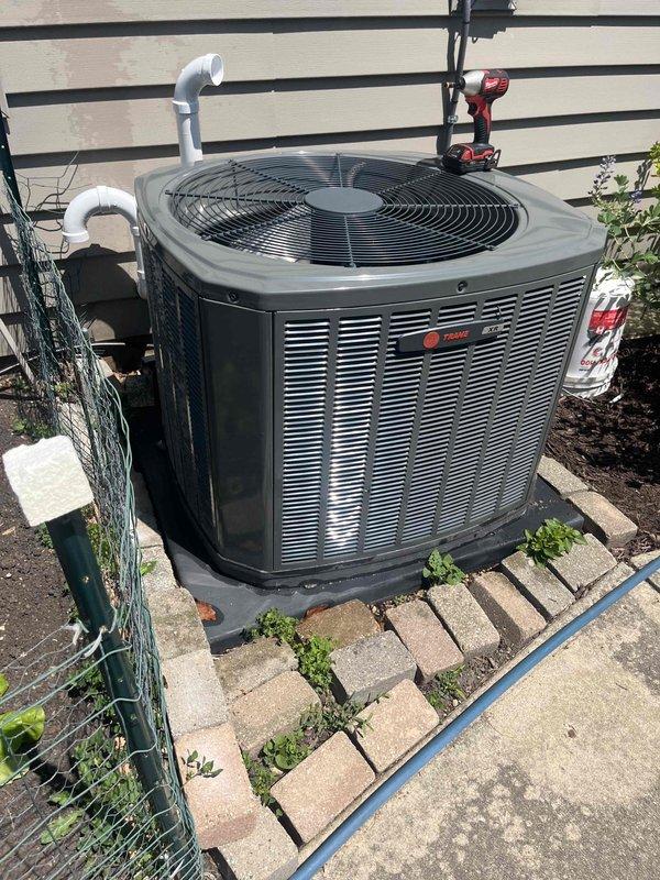 Completed comprehensive BFMA tune-up service on 3-year-old Trane air conditioning system. Performed standard preventive maintenance procedures including inspection of condenser unit, coil cleaning, refrigerant line assessment, and system operational verification. Unit found in satisfactory operating condition with copper lines showing normal oxidation; removed debris accumulation from base of outdoor unit and confirmed proper airflow through fin assembly.