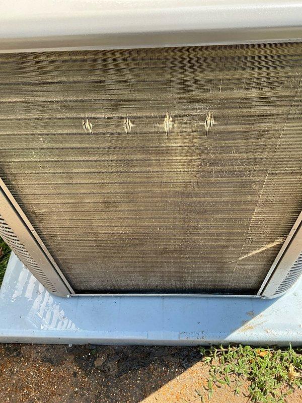 Completed comprehensive BFMA tune-up service on residential air conditioning system over one year old. Upon arrival, performed thorough inspection revealing heavily soiled condenser coils with significant dust and debris accumulation, along with dirty air filter requiring replacement. Cleaned condenser coil fins, replaced air filter, verified refrigerant levels, tested electrical connections, and confirmed proper system operation. Unit returned to optimal performance with improved airflow and efficiency.