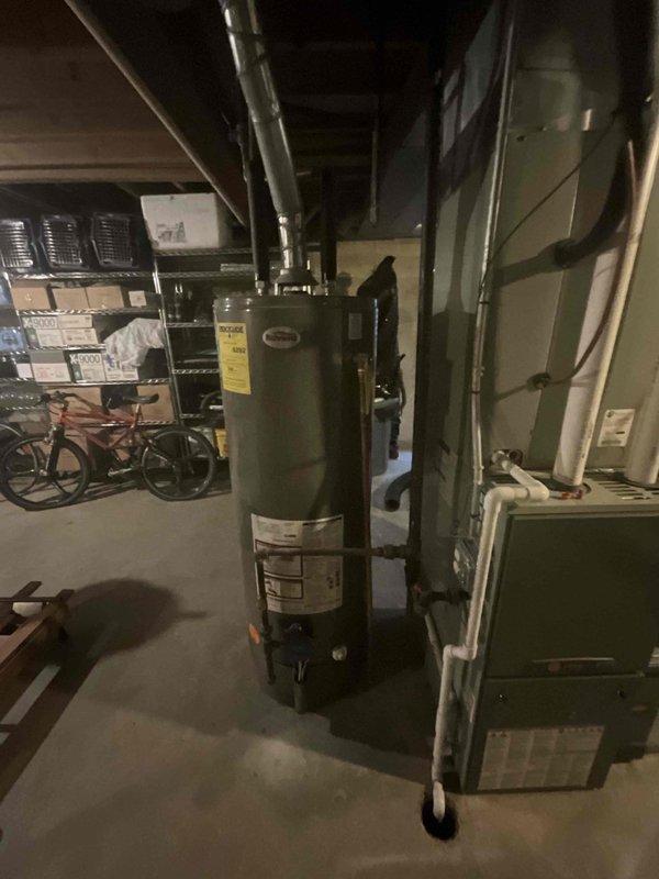 Completed comprehensive BFMA tune-up service on 11-year-old HVAC system, including full AC maintenance protocol. Inspected and serviced outdoor condenser unit, noting visible dirt accumulation on coil surfaces; cleaned and evaluated indoor furnace components in basement utility area. All equipment operational and system performance verified within normal parameters.
