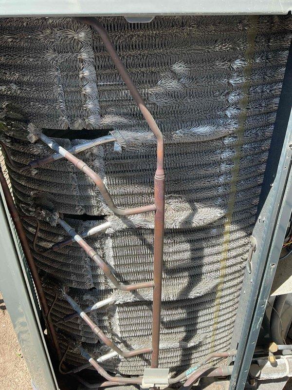 Completed comprehensive BFMA tune-up service on 5+ year old air conditioning system. Performed full system inspection, replaced air filter, and evaluated condenser coil which showed moderate to heavy accumulation of dirt, dust, and environmental debris on heat exchanger fins. Condenser unit exterior coils displayed significant contamination affecting heat transfer efficiency, with visible buildup throughout the corrugated fin assembly. Inspected refrigerant lines and insulation for proper condition. System operational upon completion of preventative maintenance procedures.
