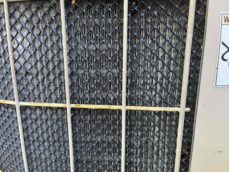 Completed comprehensive BFMA tune-up service on two air conditioning systems. Performed standard preventive maintenance protocol including inspection of air filtration system with diamond-pattern mesh panels, verified proper airflow through filter housing, and accessed HVAC components through wall-mounted service panel. All systems inspected, cleaned, and verified operational per manufacturer specifications.