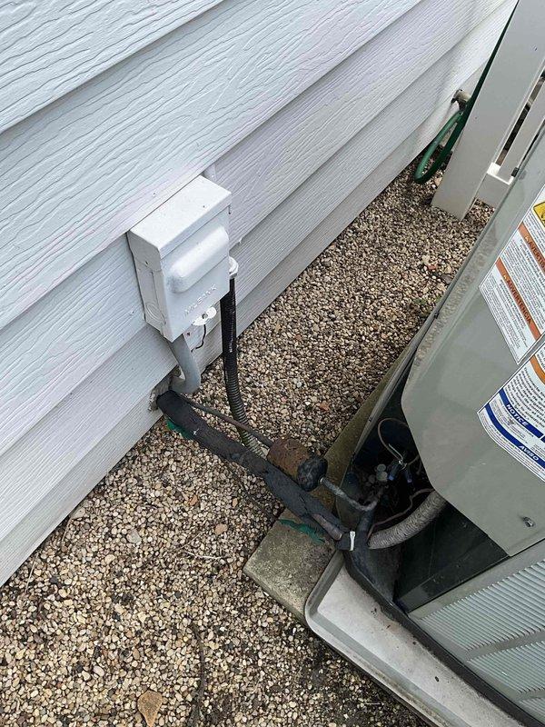Completed installation of Lennox EL16KC1-036 16 SEER outdoor condensing unit and CK40CT-30/36 evaporator coil as a matched system replacement. Unit was upgraded from standard efficiency to 16 SEER due to inventory availability. Installed refrigerant lines with proper insulation, connected electrical conduit, and positioned equipment on gravel pad alongside existing exterior wall with white siding. All connections secured with appropriate fittings and clamps, system tested and verified operational.