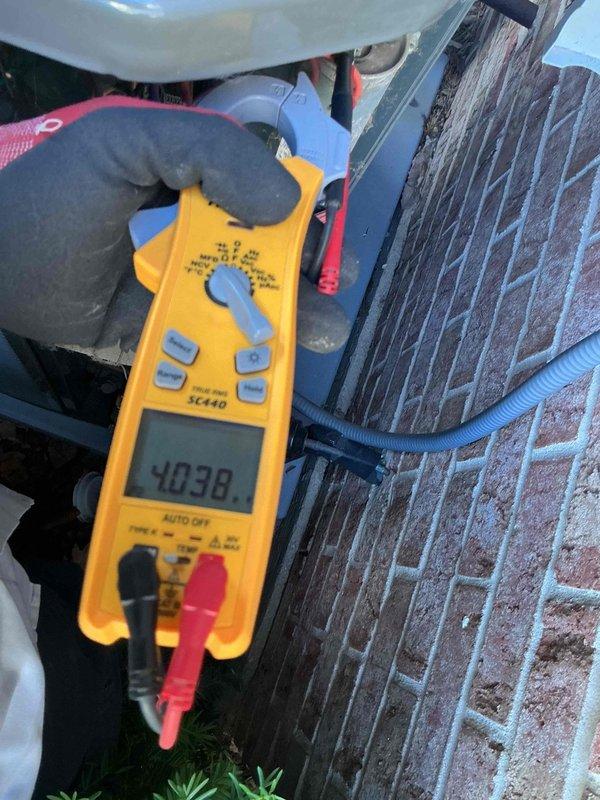 Completed comprehensive air conditioning tune-up on 9-year-old system, performing standard maintenance protocol including electrical diagnostics with clamp meter readings showing 40.38 amps on compressor circuit and 6.86 volts verification. Inspected all major components, tested system performance, checked refrigerant lines and electrical connections, and confirmed unit operating within manufacturer specifications.