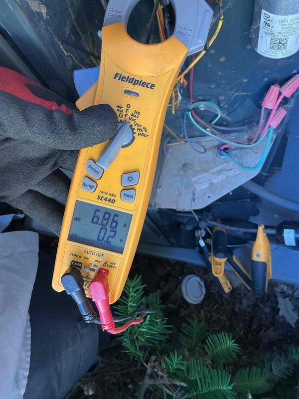 Completed comprehensive air conditioning tune-up on 9-year-old system, performing standard maintenance protocol including electrical diagnostics with clamp meter readings showing 40.38 amps on compressor circuit and 6.86 volts verification. Inspected all major components, tested system performance, checked refrigerant lines and electrical connections, and confirmed unit operating within manufacturer specifications.