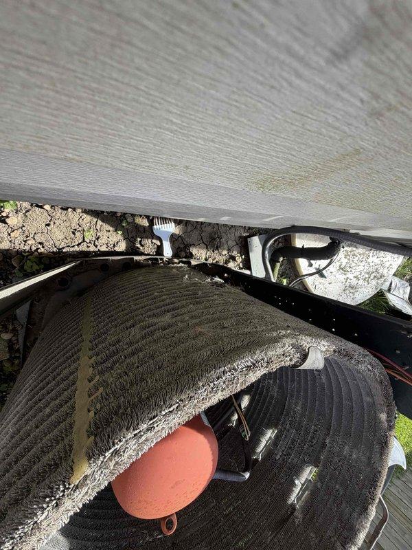 Completed scheduled BFMA preventive maintenance tune-up on 13-year-old residential air conditioning system. Performed comprehensive inspection of outdoor condensing unit, including evaluation of compressor operation, refrigerant levels, and heat exchanger coil condition. Noted visible damage to unit housing with torn section exposing internal wiring and copper tubing, which will require future attention to prevent weather exposure and potential component degradation. Verified proper drainage pan placement and assessed overall system performance to ensure optimal cooling efficiency for the upcoming season.
