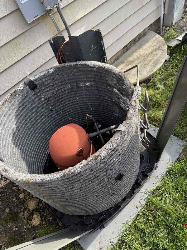 Completed scheduled BFMA preventive maintenance tune-up on 13-year-old residential air conditioning system. Performed comprehensive inspection of outdoor condensing unit, including evaluation of compressor operation, refrigerant levels, and heat exchanger coil condition. Noted visible damage to unit housing with torn section exposing internal wiring and copper tubing, which will require future attention to prevent weather exposure and potential component degradation. Verified proper drainage pan placement and assessed overall system performance to ensure optimal cooling efficiency for the upcoming season.