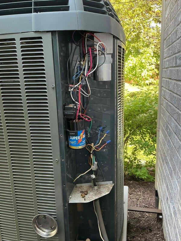 Responded to callback for real-time refrigerant measurements on Trane outdoor condensing unit. Accessed unit and obtained current Fieldpiece readings for side 1 refrigerant system to verify 2025 measurements and system performance. Documented findings with photos of internal components and overall unit condition.