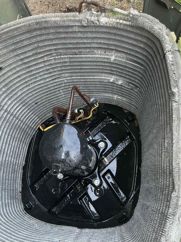 Completed comprehensive BFMA tune-up service on residential air conditioning system aged 4+ years. Performed standard maintenance procedures including inspection of compressor assembly, verification of refrigerant lines and insulation integrity, examination of electrical connections and wiring, and assessment of condensing unit components. Unit showed normal wear with debris accumulation noted in blower assembly area; all mechanical components found operational with proper condensation present on compressor housing indicating active cooling cycle.