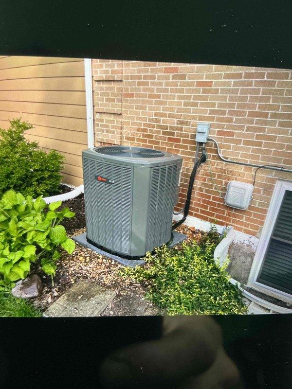 Completed comprehensive BFMA tune-up service on 2-year-old Trane air conditioning system. Performed routine maintenance including inspection of outdoor condenser unit, verified proper refrigerant line connections, checked electrical disconnect, and assessed crawlspace ductwork and plenum installation. All components found operating within normal parameters with no deficiencies noted at time of service.