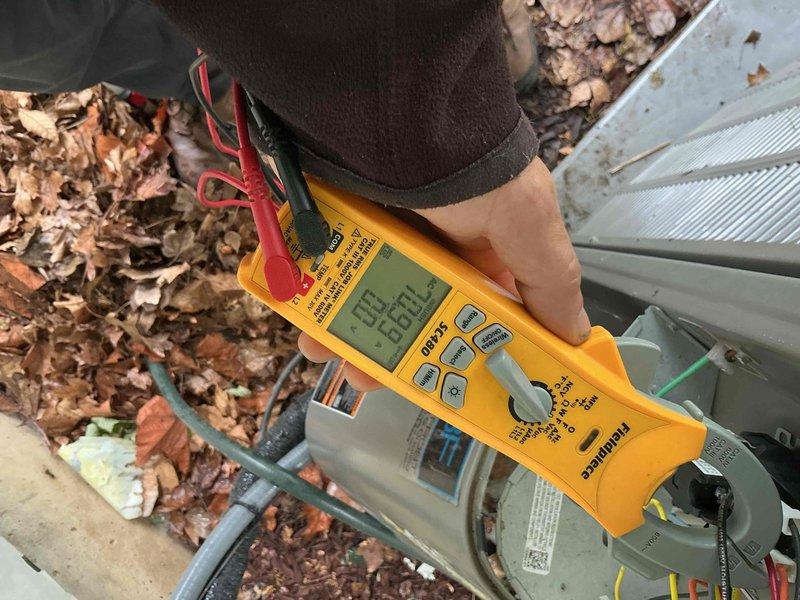 Completed comprehensive BFMA tune-up on residential air conditioning unit aged 1+ years. Upon arrival, performed thorough inspection revealing significant debris accumulation including dried leaves and organic matter throughout unit interior, along with extensive rust and corrosion on metal housing and base plate. Cleaned condenser coil fins and removed all debris from unit. Tested electrical components using digital multimeter to verify proper voltage and amperage readings on capacitor and compressor system. Inspected all wiring connections and verified system operation. Unit running within manufacturer specifications following service completion.