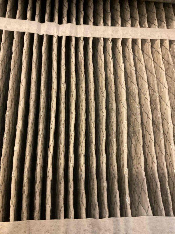 Completed comprehensive BFMA tune-up on an 11-year-old Carrier air conditioning system. Performed standard maintenance protocol including inspection of outdoor condenser unit, verification of proper airflow through coil sections, and assessment of air filtration system. Inspected pleated air filter showing moderate dust accumulation consistent with normal operation, verified unit integrity and proper positioning on concrete pad with adequate clearance from surrounding landscaping.