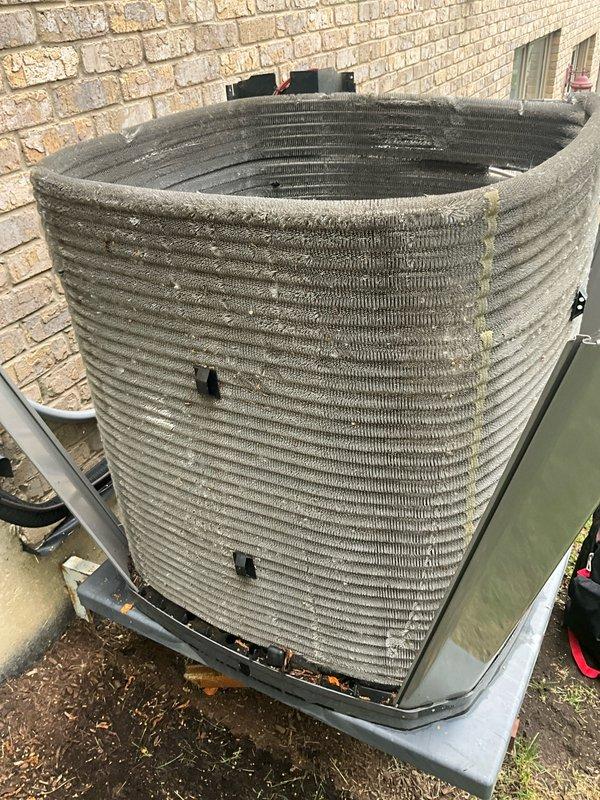 Completed comprehensive BFMA tune-up on 7+ year old outdoor condenser unit. Upon arrival, found heat exchanger coils heavily caked with dirt, dust, lint, and organic debris throughout the fin assembly, significantly restricting airflow and reducing system efficiency. Performed thorough coil cleaning to remove accumulated contaminants from all exterior surfaces and between fin spaces, restoring proper heat transfer capability. Inspected refrigerant lines, electrical connections, and mounting hardware. Unit now operating within normal parameters with improved airflow and heat exchange efficiency.