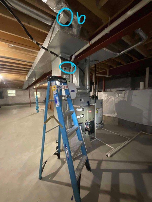 Conducted comprehensive sales estimate for air conditioning and evaporator coil replacement system. Evaluated existing HVAC installation located in unfinished basement area, assessing current ductwork configuration, air handler unit, and associated supply and return plenum connections. Documented Aprilaire Digital Ventilation Controller installed on system ductwork, noting active ventilation control settings and minutes-per-hour dial configuration. Photographed overhead rectangular sheet metal duct runs, flexible ductwork connections, and equipment positioning to determine proper sizing and compatibility requirements for proposed replacement system. Assessed accessibility for future installation, noting exposed ceiling joists, concrete flooring, and adequate workspace for equipment changeout. Prepared equipment recommendations based on existing infrastructure and customer comfort requirements.