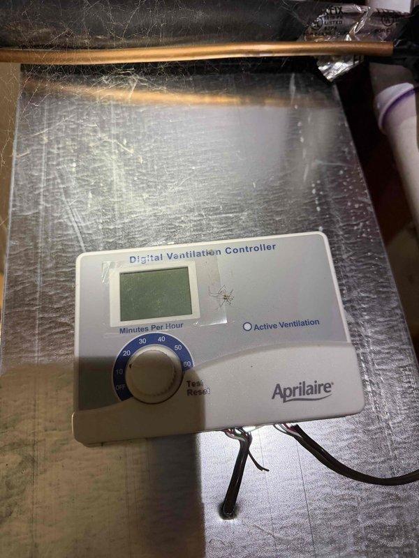 Conducted comprehensive sales estimate for air conditioning and evaporator coil replacement system. Evaluated existing HVAC installation located in unfinished basement area, assessing current ductwork configuration, air handler unit, and associated supply and return plenum connections. Documented Aprilaire Digital Ventilation Controller installed on system ductwork, noting active ventilation control settings and minutes-per-hour dial configuration. Photographed overhead rectangular sheet metal duct runs, flexible ductwork connections, and equipment positioning to determine proper sizing and compatibility requirements for proposed replacement system. Assessed accessibility for future installation, noting exposed ceiling joists, concrete flooring, and adequate workspace for equipment changeout. Prepared equipment recommendations based on existing infrastructure and customer comfort requirements.