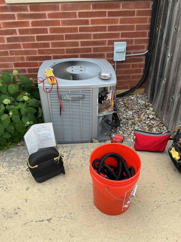 Completed comprehensive BFMA tune-up service on Armstrong air conditioning system approximately 5 years old. Performed full system diagnostics using manifold gauges to check refrigerant pressures and temperatures, verified proper refrigerant charge levels, and inspected all copper line connections for leaks or wear. Cleaned condenser unit exterior panels and internal components, checked electrical connections at disconnect box, and ensured all safety controls were functioning properly. System operating within manufacturer specifications with no deficiencies noted.