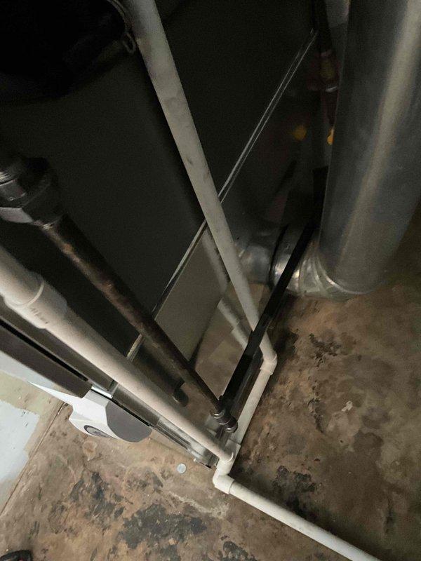 Completed full HVAC system installation featuring a Lennox 80% AFUE gas furnace (model EL297UH070XV36BK) paired with a 2-ton air conditioning condenser (model EL15KC1-024) and evaporator coil (model CK40CT-24B). Installed new ductwork connections with insulated supply plenums, configured Ecobee smart thermostat for system control, and integrated AA1210 accessory package for optimal system performance. Coordinated with plumbing contractor to elevate water heater on brick platform and adjust flue piping to accommodate new furnace installation and ensure proper venting clearances in the utility room.